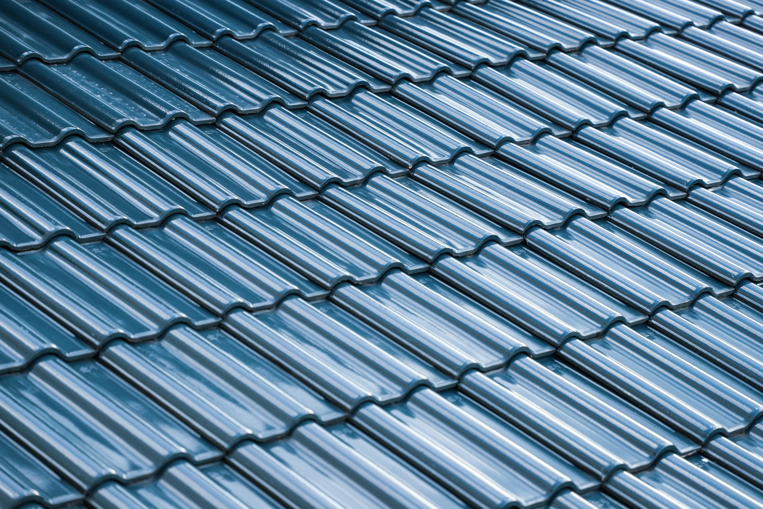 Blue glazed metal shingle roof tiles